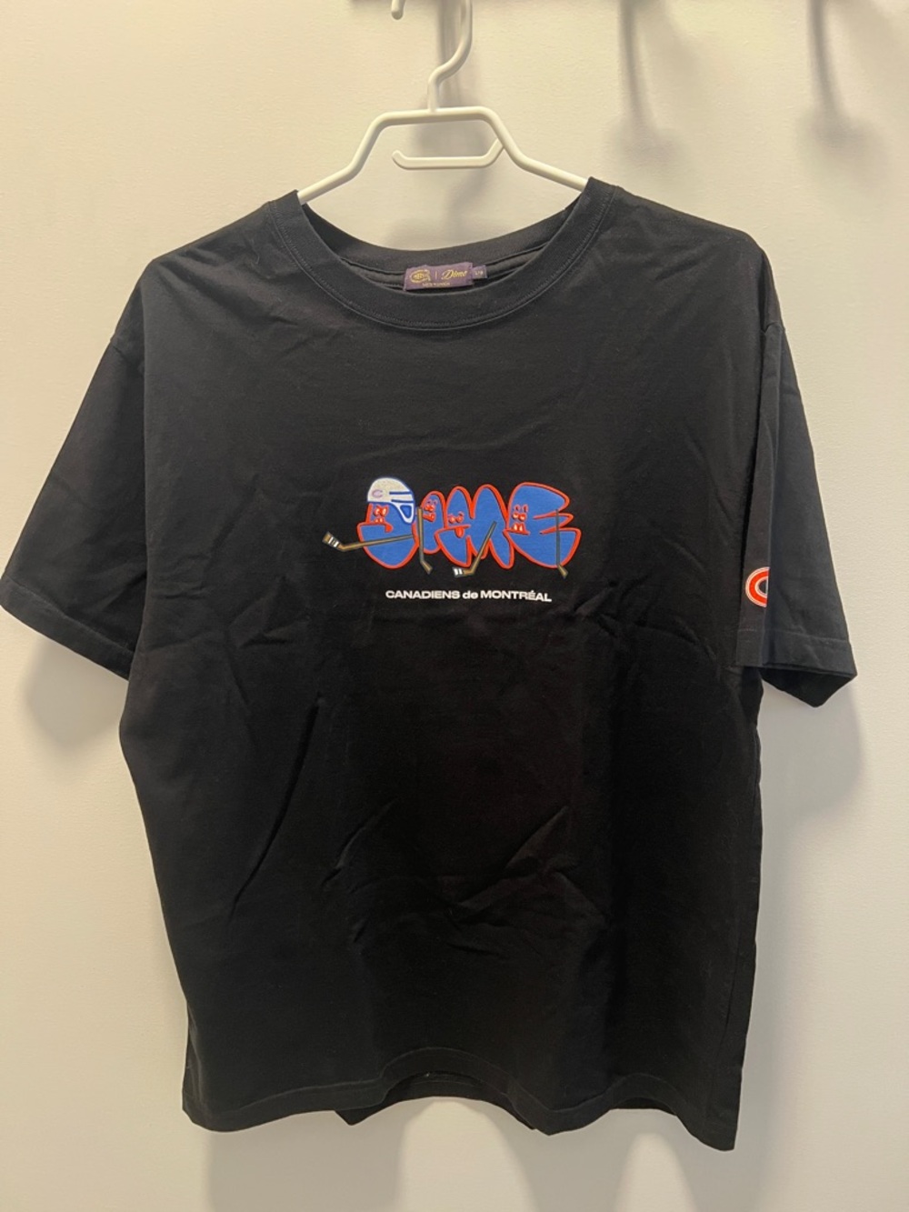Black Graphic Tee with Colorful Chest Print